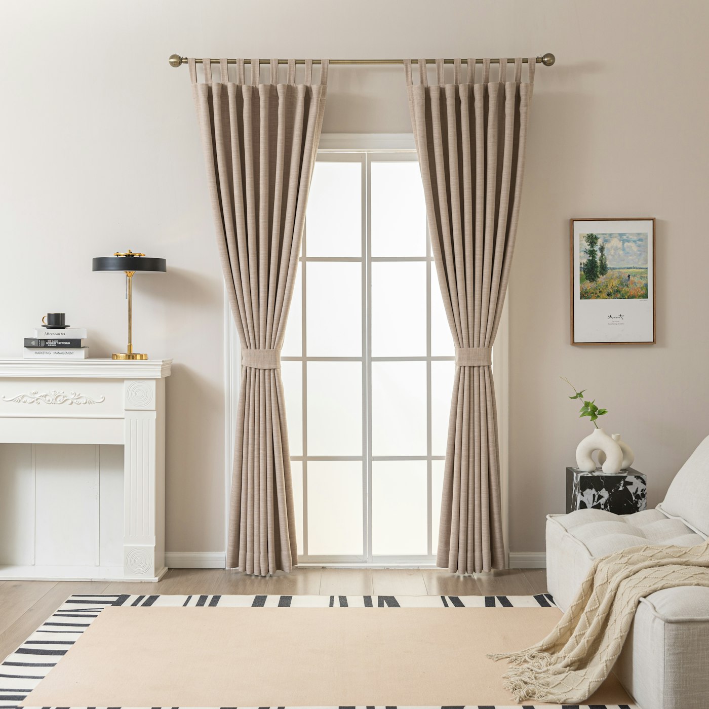 Neutral curtains hanging beside a bright living room window